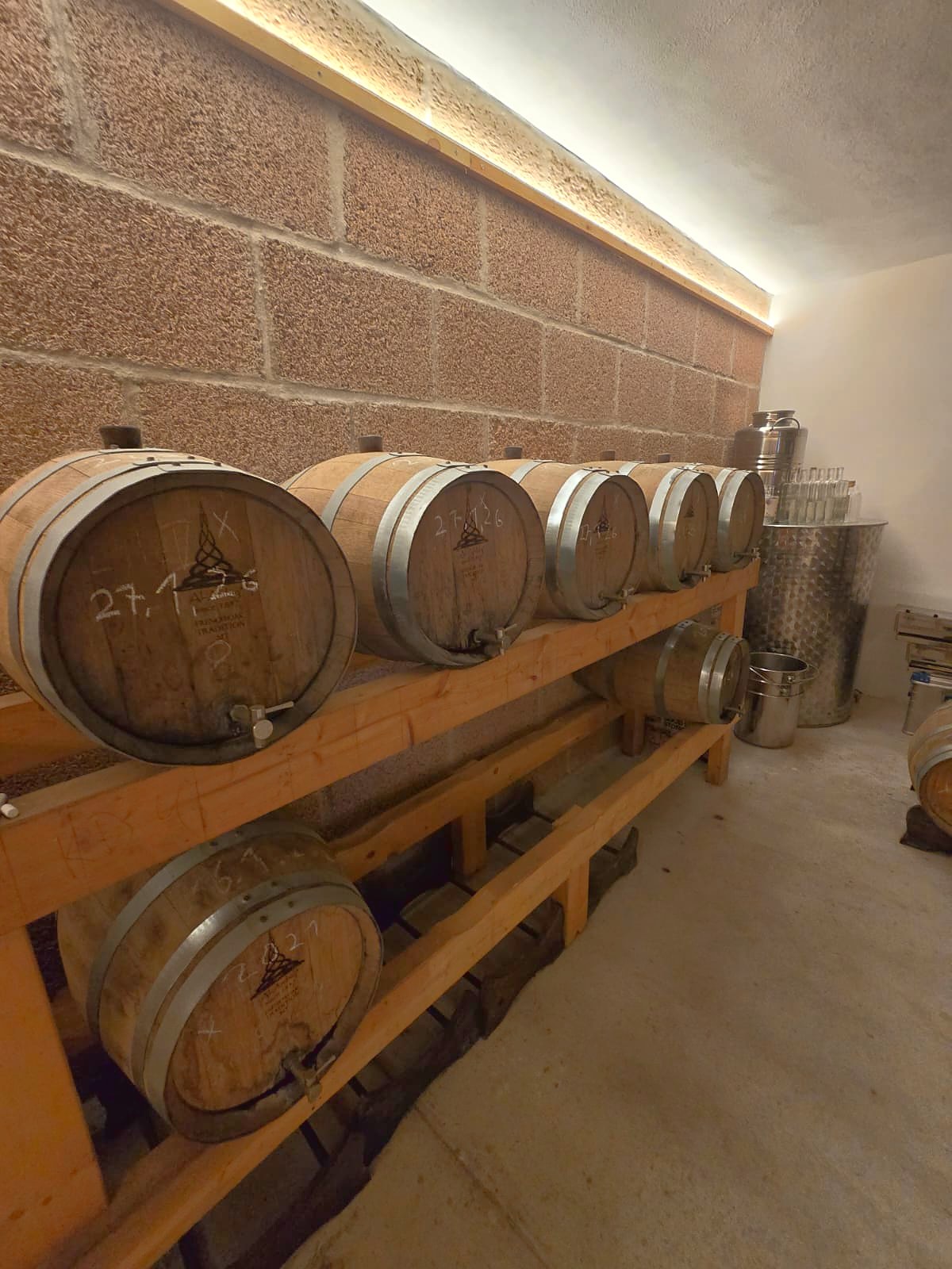 Oak barrels ageing medronho brandy at Monte Novo da Serra